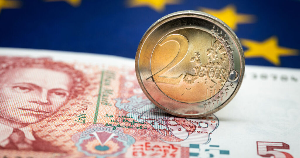 Bulgarian money next to a 2 Euro coin, Concept of Bulgaria joining the single currency of the European Union