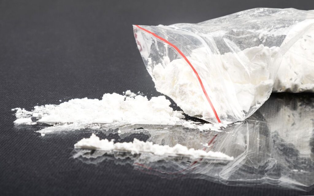 sprinkled white amphetamine powder, concept snuff drug addiction
