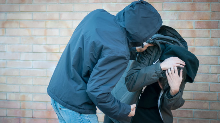 Bullying, aggression and violence scene between two young adult males